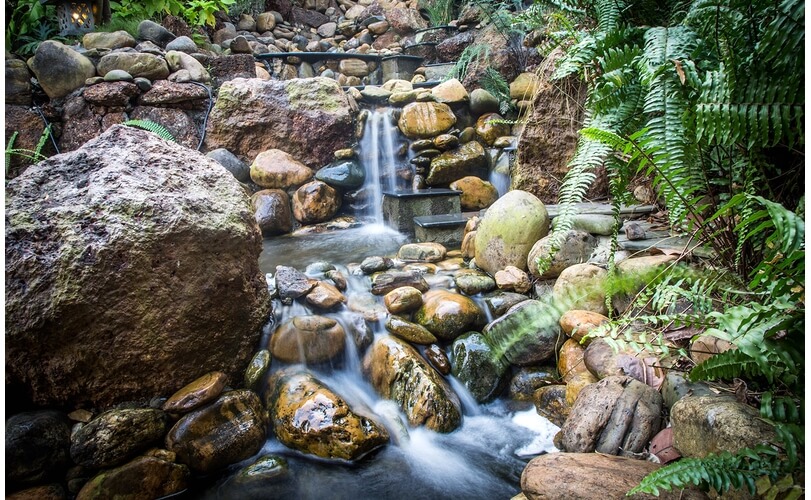 The waterfall follows the natural contours