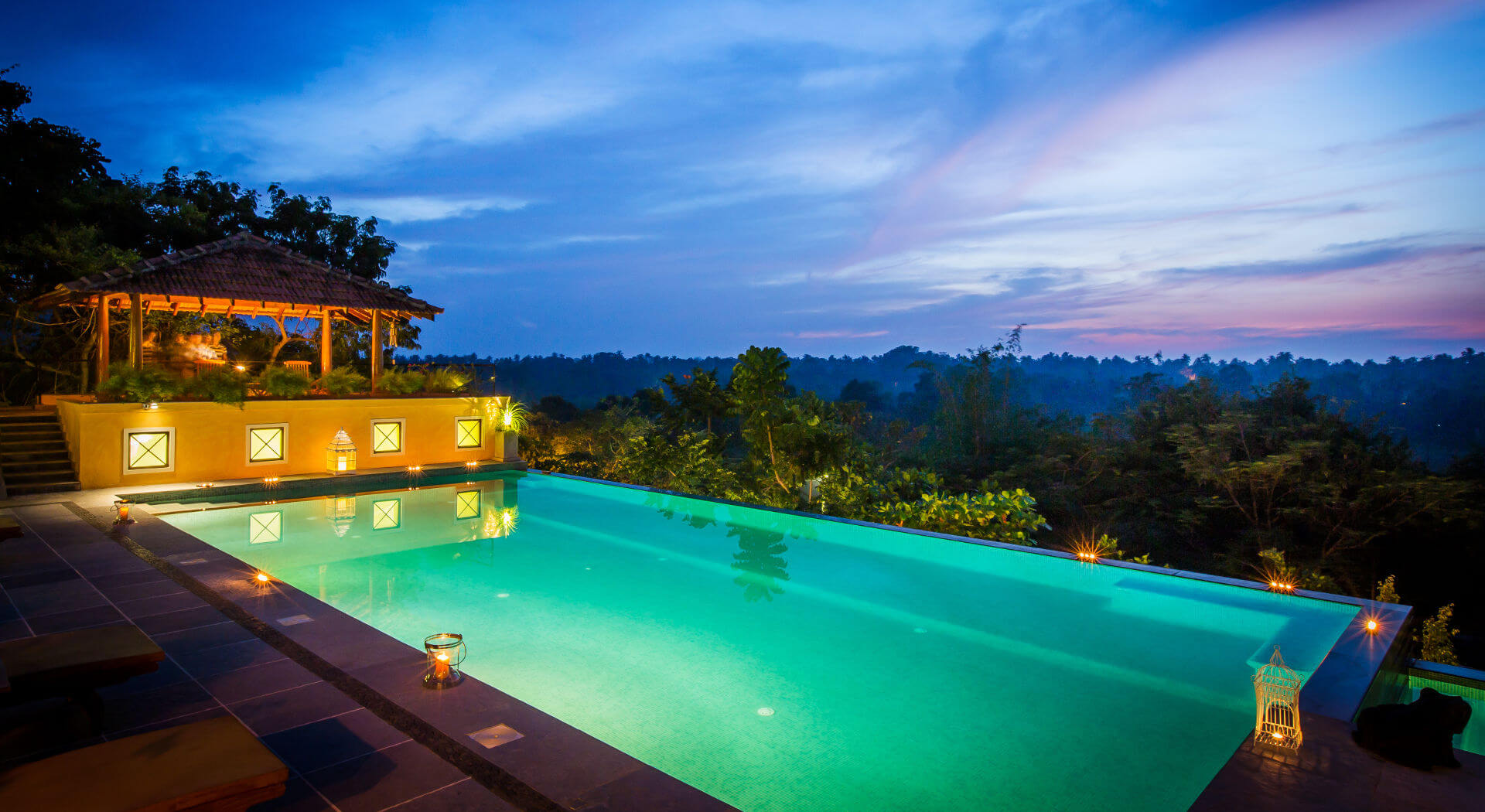 Pool and pavilion at night